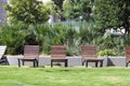 Wooden Chase Lounges in a park like atmosphere Royalty Free Stock Photo