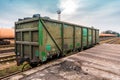 Unloading bulk cargo from railway wagon Royalty Free Stock Photo