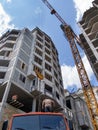 Unloading the car at a construction site with the use of the tower crane