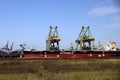 Unloading of a coal bulk ship at the Maasvlakte Harbor Royalty Free Stock Photo