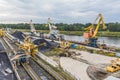 Unloading coal at a power plant many cranes Royalty Free Stock Photo