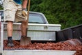 Unloading lava stone from truck Royalty Free Stock Photo