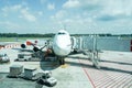 Unloading luggage from plane in Bangkok Royalty Free Stock Photo