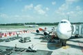 Unloading luggage from plane Royalty Free Stock Photo