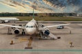 Unloading suitcases from the plane Royalty Free Stock Photo