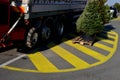 unloading trees from a truck with horticultural produce. transshipment at