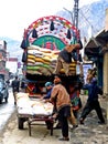 unloading a truck in the streets of Gilgit, district capital of Gilgit-Baltistan, Pakistan