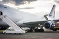 Unloading wide body cargo airplane Royalty Free Stock Photo