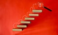 Unlock potential of learning and education concept with ladder of success, books and magnifying glass on red background. Large