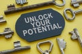 Unlock your potential phrase on the plate and keys around. Royalty Free Stock Photo