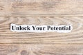 unlock your potential text on paper. Word unlock your potential on torn paper. Concept Image Royalty Free Stock Photo