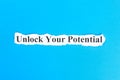 unlock your potential text on paper. Word unlock your potential on torn paper. Concept Image Royalty Free Stock Photo