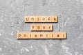 Unlock your potential word written on wood block. unlock your potential text on table, concept