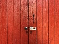 Unlocked but Closed; red wooden door Royalty Free Stock Photo