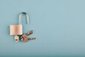 Unlocked Padlock and bunch of key on the blue background Royalty Free Stock Photo