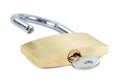 Unlocked padlock with a key in the keyhole Royalty Free Stock Photo