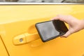 Unlocking car doors wth mobile phone Royalty Free Stock Photo