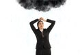 Unlucky businesswoman with a black cloud full of rain over her head