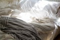 Unmade bed with messy duvet cover in morning light Royalty Free Stock Photo