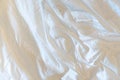 Unmade bedroom in the morning. White blanket with wrinkle messy on bed. Copy space, top view Royalty Free Stock Photo