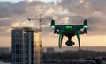 Unmanned Aircraft System Quadcopter Drone In The Air Near City and Corporate Building