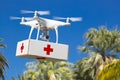 Unmanned Aircraft System UAS Quadcopter Drone Carrying First Aide Kit Royalty Free Stock Photo