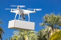 Unmanned Aircraft System UAV Quadcopter Drone Carrying Blank Box Royalty Free Stock Photo