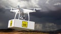 Unmanned Aircraft System UAV Quadcopter Drone Carrying Package Royalty Free Stock Photo