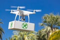 Unmanned Aircraft System UAV Quadcopter Drone Carrying Package Royalty Free Stock Photo