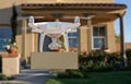 Unmanned Aircraft System UAV Quadcopter Drone Delivering Package To House Royalty Free Stock Photo