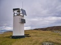 An unmanned, automatic solar powered lighthouse in Shetland, UK Royalty Free Stock Photo