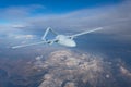 Unmanned military drone uav flying in the air, reconnaissance flight over the territory above the snow-capped mountains hills Royalty Free Stock Photo