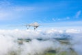 An unmanned vehicle flies over the clouds control and tracking the sky over the territory