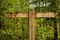 Unmarked wooden sign post with no text, pointing the direction of each trail