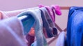 Mismatched socks drying on a rack, daytime. Depicting laundry day, cleaning, house chores and missing sock pairs Royalty Free Stock Photo