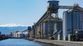 The unmistakable scent of freshly processed grain permeating the air as it is loaded and unloaded at the bustling port Royalty Free Stock Photo