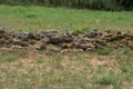 Unmortared field stone wall of rough, unworked stones