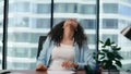 Unmotivated woman office worker tired of work sitting modern desk close up. Royalty Free Stock Photo