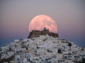 An unnatural big moon over the castle of Astypalaia Royalty Free Stock Photo