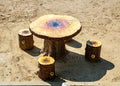 Unnatural table and chairs in the form of stumps Royalty Free Stock Photo