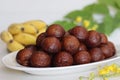 Unniyappam. Delicious sweet rice fritters made with a batter of rice, banana, jaggery, ghee fried coconut pieces, black sesame