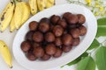 Unniyappam. Delicious sweet rice fritters made with a batter of rice, banana, jaggery, ghee fried coconut pieces, black sesame