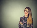 Unny confused young skeptical woman in glasses thinking looking up Royalty Free Stock Photo