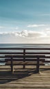 Unoccupied bench offers serene ocean view on pier