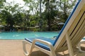 Unoccupied sunbed by the pool with nobody Royalty Free Stock Photo