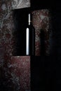 Unopened bottle of red wine on a background of old wall