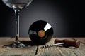Unopened bottle of red wine, corkscrew, and empty wine glass on an old wooden table Royalty Free Stock Photo