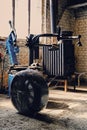 Unpacked car`s tire near the tire changer machine. Royalty Free Stock Photo