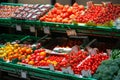 Unpacked, fresh assortment of tomatoes in a self-service supermarket