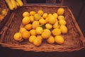 Unpacked organic lemons in basket on display in organic super market. Royalty Free Stock Photo
